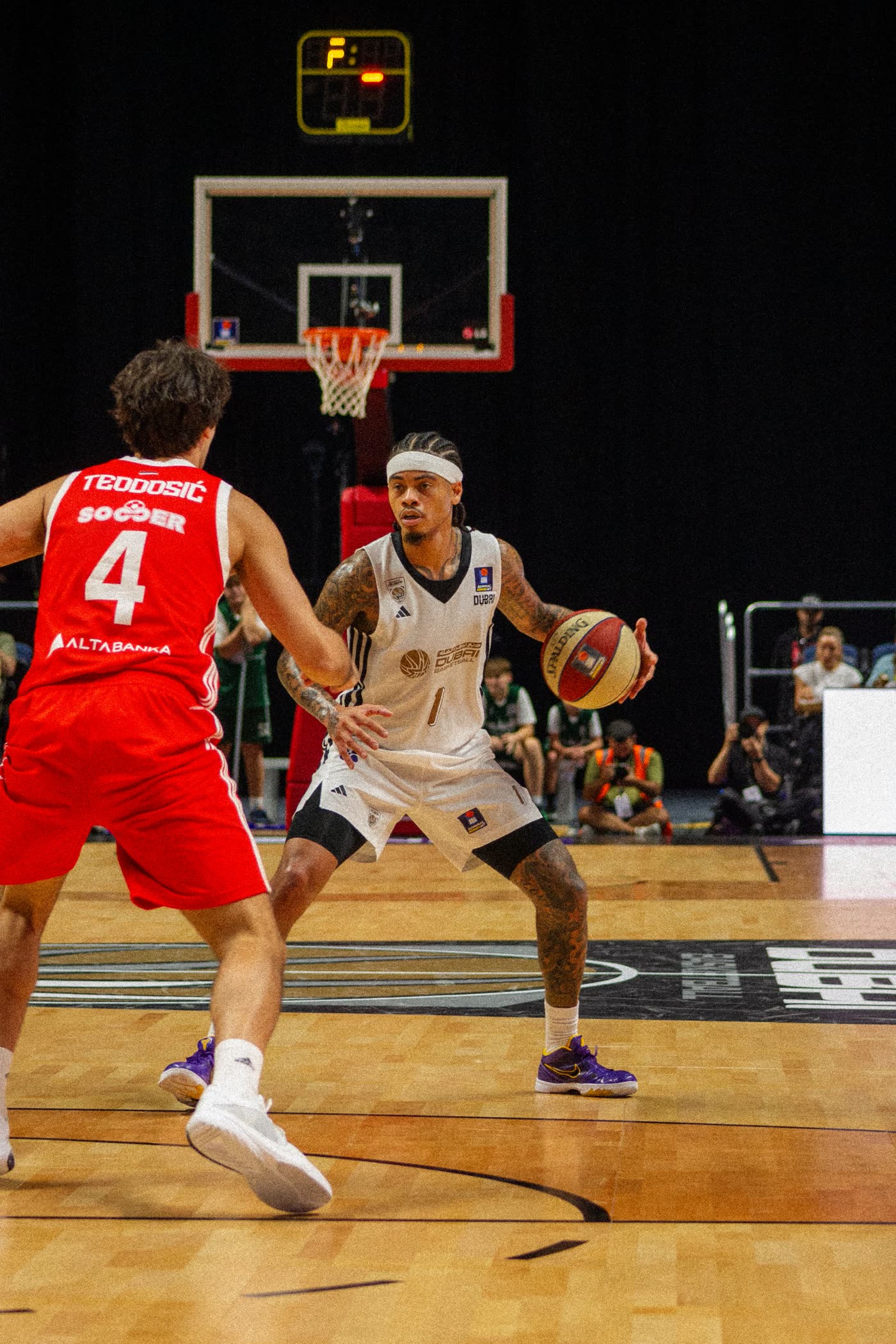 Dubai Basketball number 1 facing up against Teodosić of Crvena Zvezda